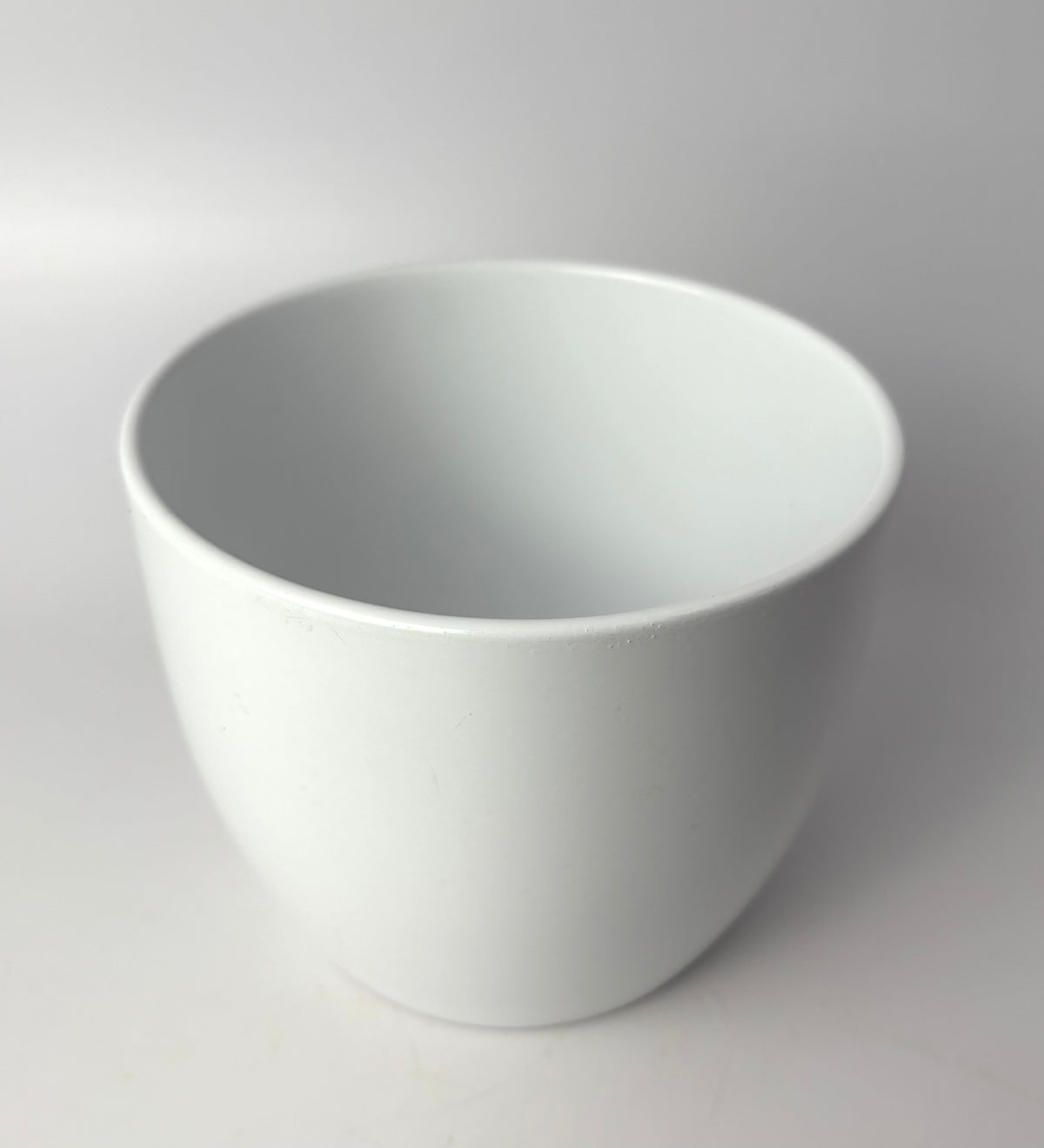 White Basel 4.7-inch planter with smooth rounded sides on a light background