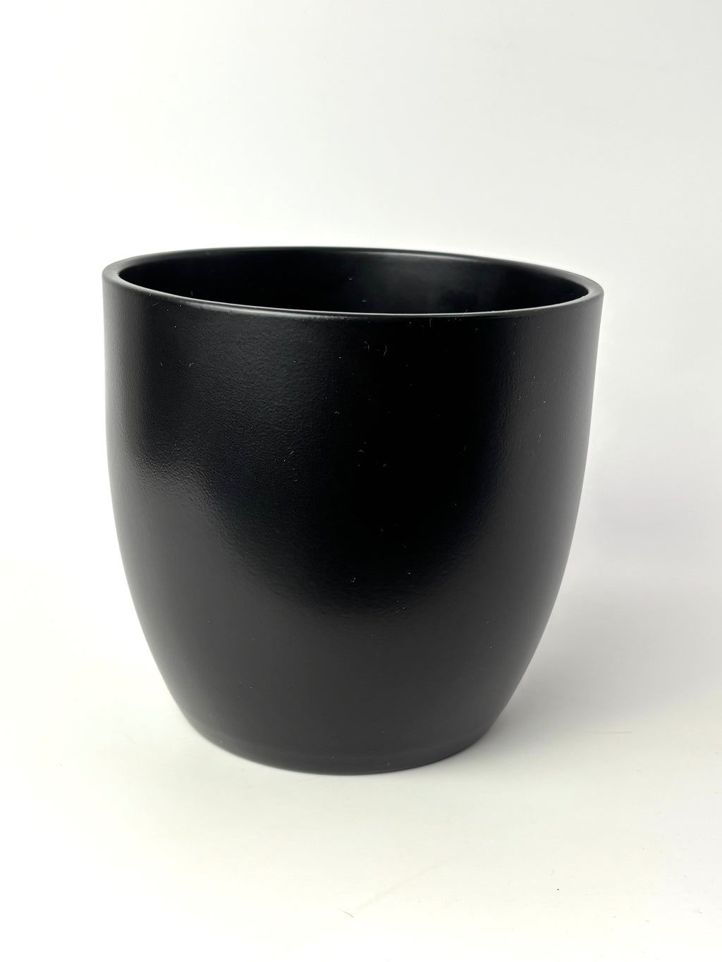 Black Basel 6-inch planter with smooth rounded sides on a light background