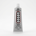 Large 3.7 oz E6000 clear adhesive tube with white cap and red-outlined black label on a white background.