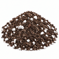 Succulent and cactus soil blend piled on a white background, showing brown potting soil and white perlite and pumice
